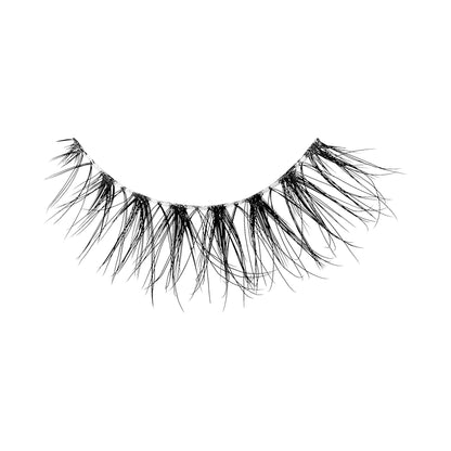 A single false lash strip in a natural lash pattern with a clear band, shown against a white background. Lash is &