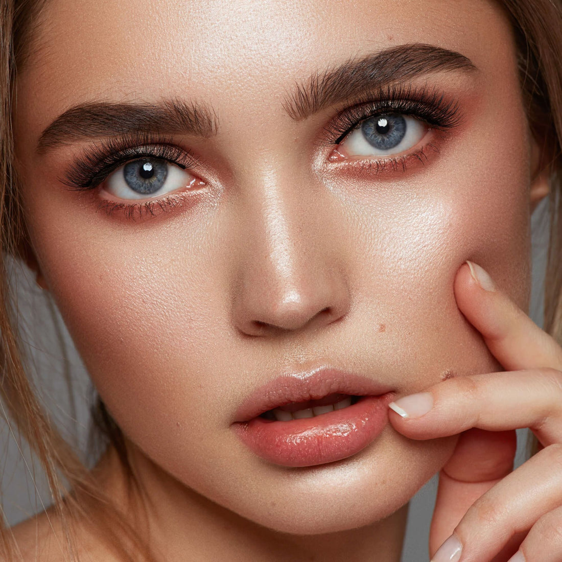 Close-up of a woman modeling lashes from the KISS Magnetic Eyeliner starter kit in &