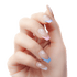 A hand modeling KISS nails in &